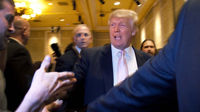 Donald Trump greets supporters before speaking to a crowd of 600 people during a gathering of Republican women's groups, Thursday, April 28, 2011, in Las Vegas.  