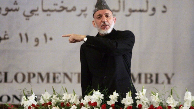 Afghan president Hamid Karzai lauded Osama bin Laden's death as a serious blow to terrorism Monday and argued that the strike in Pakistan proves the real fight against terrorists is outside his country's borders. 