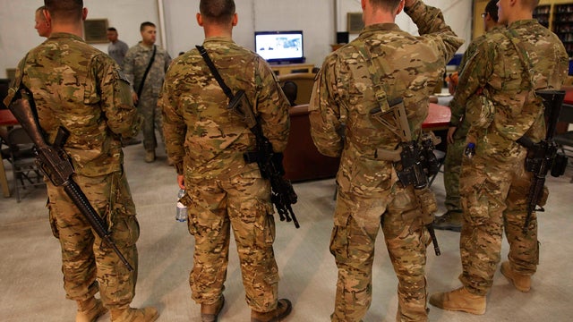 U.S. troops stationed at Kandahar Airfield, Afghanistan, watch breaking news on the announcement by President Barack Obama that Osama bin Laden had been killed. 