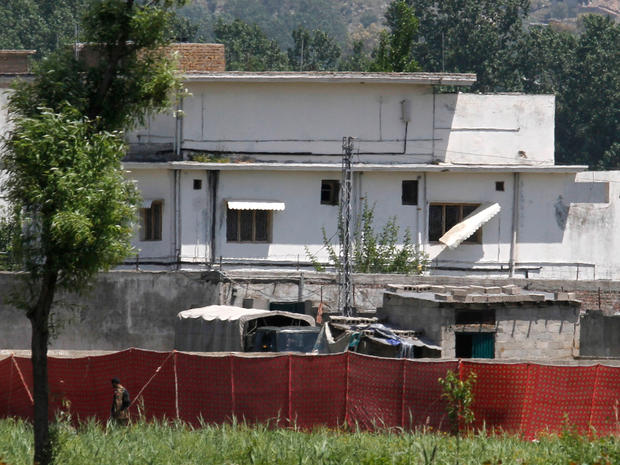 A Pakistani soldier stands near a compound where it is believed al-Qaida leader Osama bin Laden lived in Abbottabad, Pakistan 