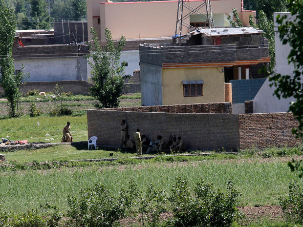 Pakistan army soldiers rest near the house where it is  believed al-Qaida leader Osama bin Laden lived in Abbottabad, Pakistan 