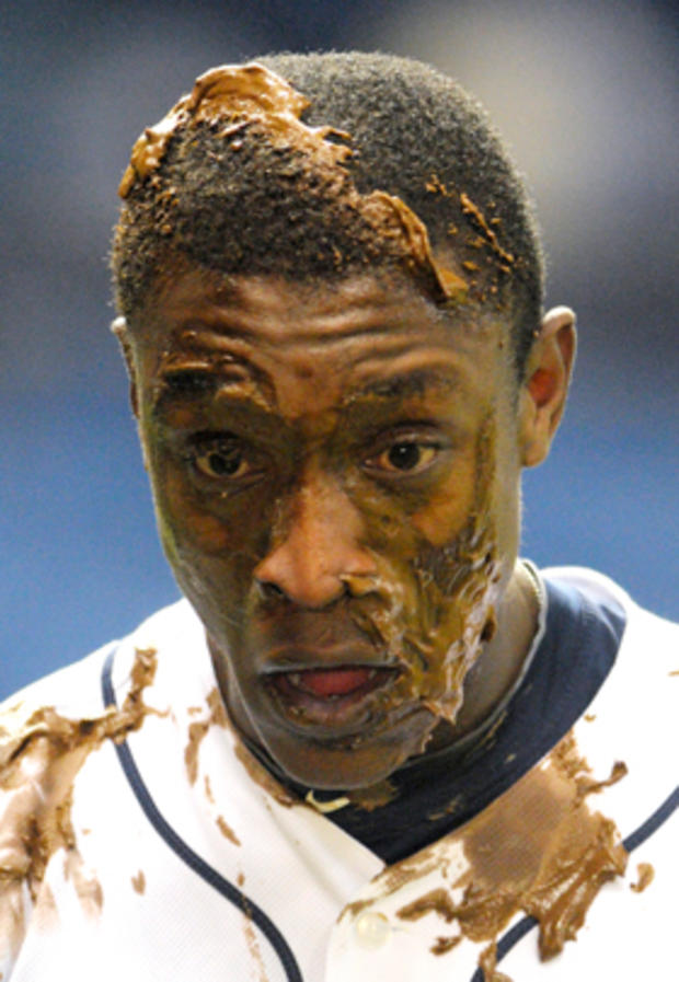 Tampa Bay Rays' B.J. Upton reacts after he was smashed in the face with chocolate pudding 