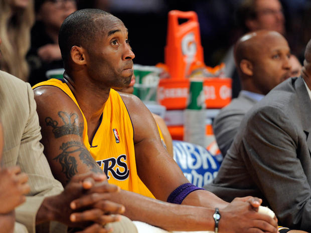 Kobe Bryant looks on from the bench in the closing seconds 