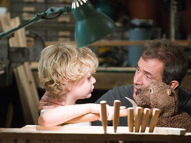 Riley Thomas Stewart, left, and Mel Gibson are shown in a scene from, "The Beaver." 