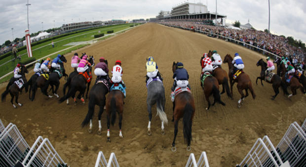 horses leave the starting gate during the 137th Kentucky Derby 