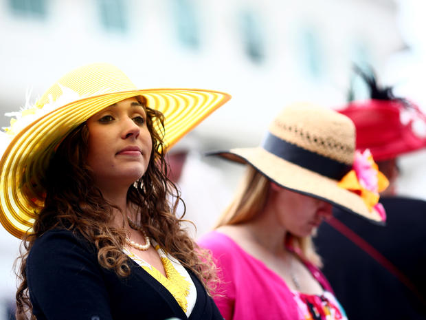 Horse racing fans show their Derby hats at the paddock in Churchill Downs before the 137th running of the Kentucky Derby in Louisville, Ky., on May 7, 2011. 