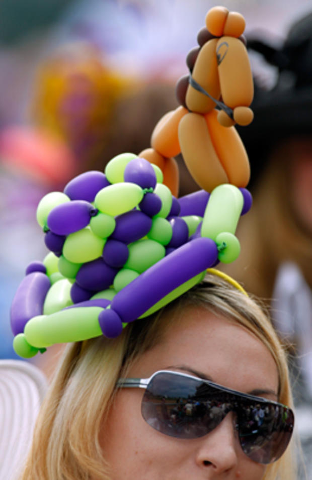 A spectator wears a balloon hat before the 137th Kentucky Derby horse race at Churchill Downs Saturday, May 7, 2011, in Louisville, Ky. 
