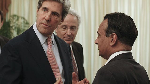 U.S. Senator John Kerry, left, talks with Hussain Haqqani, right, Pakistan ambassador to the United States, in Islamabad, Pakistan, on May 16, 2011.  