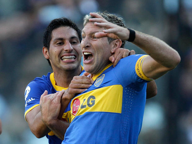 Martin Palermo, front, celebrates with teammate Juan Insaurralde 