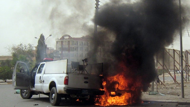 A car burns following a bomb attack 