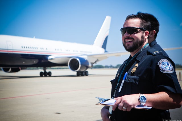 Customs agents watch planes land 