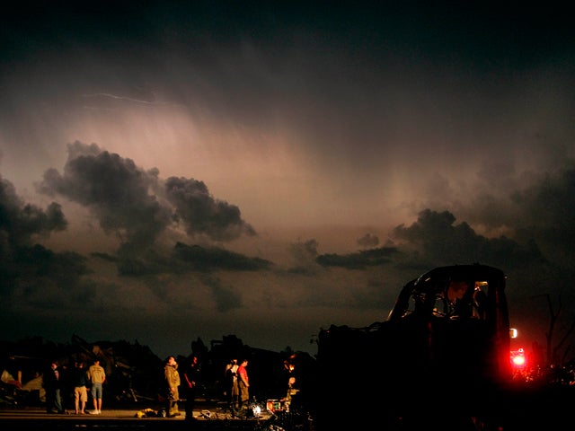 Emergency workers search for victims of tornado 