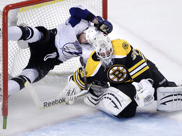 Boston Bruins goalie Tim Thomas makes a save 
