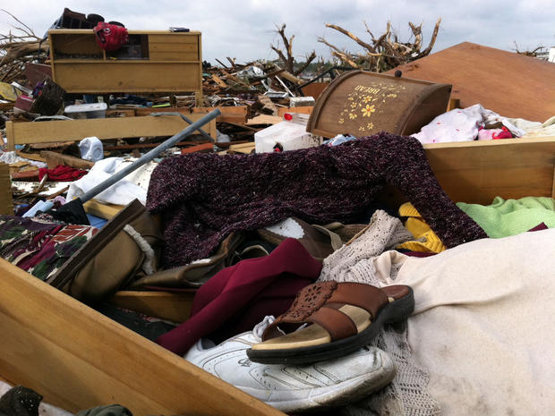 Household items are strewn about in the aftermath of the tornado there on Sunday.  