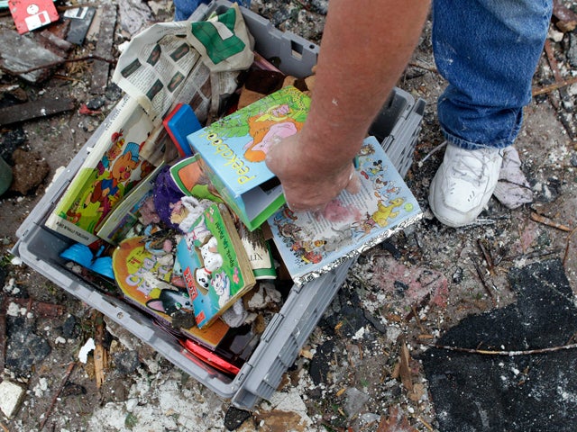 Kenneth Thomas searches through toys  