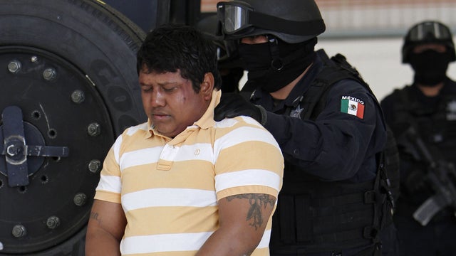 Police escort Julio de Jesus Radilla Hernandez, aka "El Negro" 