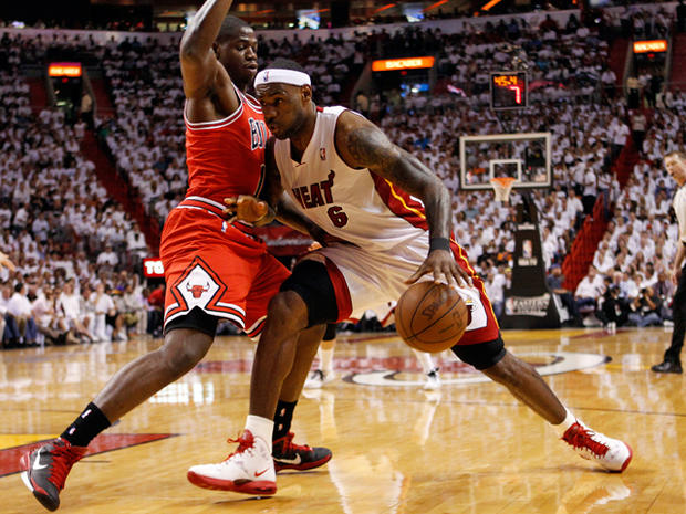 LeBron James dribbles past Ronnie Brewer 
