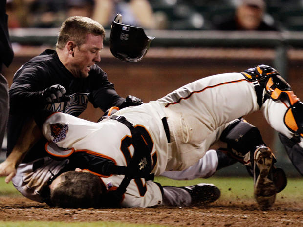 Scott Cousins collides with catcher Buster Posey  