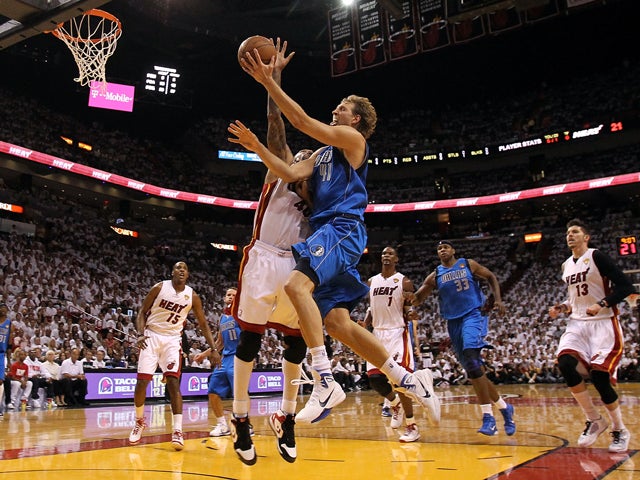 Dirk Nowitzki drives for a shot 