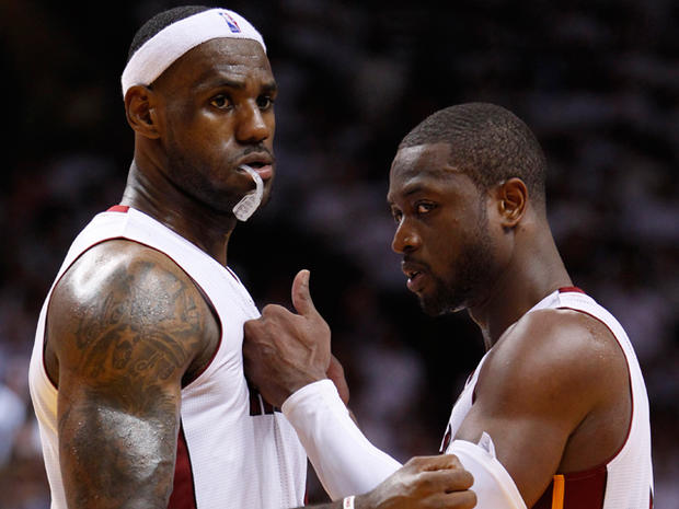 Heat's Dwyane Wade, right, and LeBron James speak 