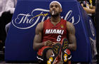 LeBron James takes a break during a time out 