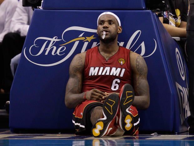 LeBron James takes a break during a time out 