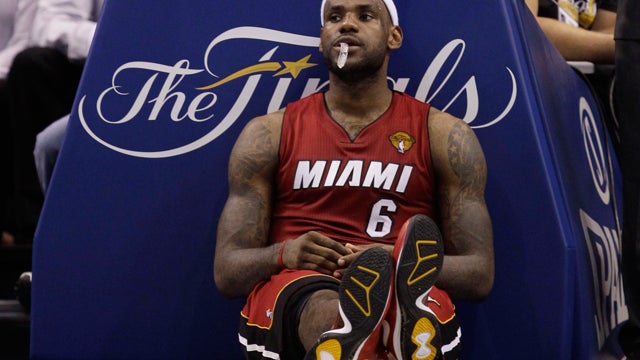 LeBron James takes a break during a time out 
