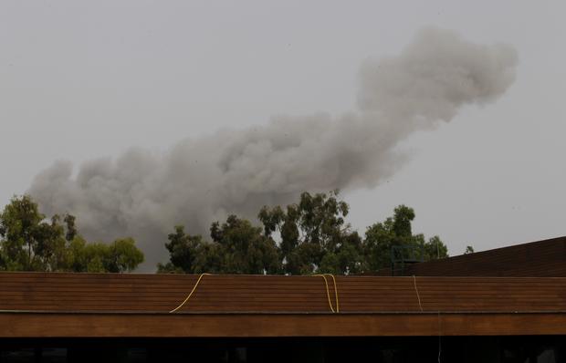 Smoke rises over Tripoli after a NATO airstrike 
