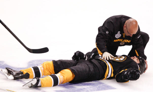 Nathan Horton is tended to by a trainer 
