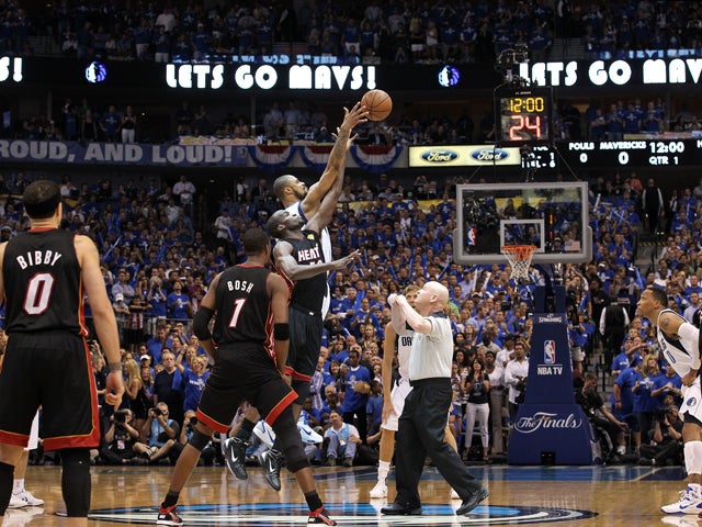 Tyson Chandler and Joel Anthony go up for the opening jump to start Game Five  
