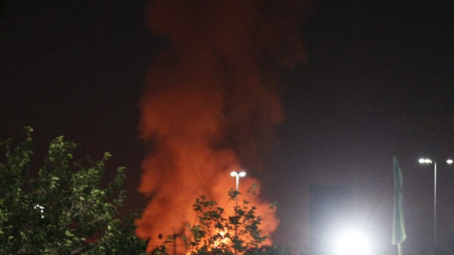 Smoke rises after an air strike on Tripoli 