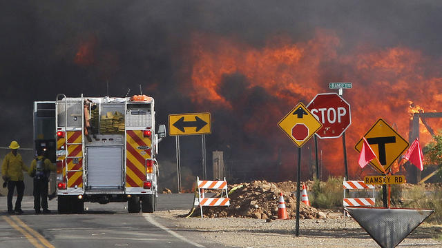 The Monument Fire devours a home near Sierra Vista, Ariz. 