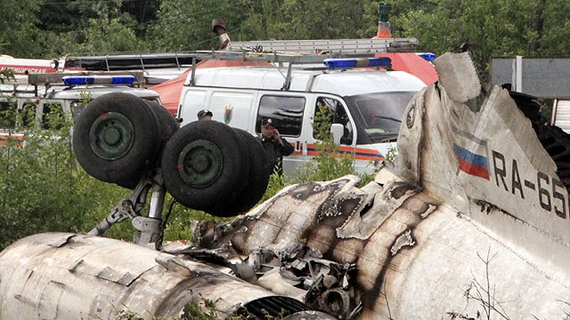 Emergency Ministry cars seen near a wreckage of Tu-134 plane, belonging to the RusAir airline, near the city of Petrozavodsk, June 21, 2011. 