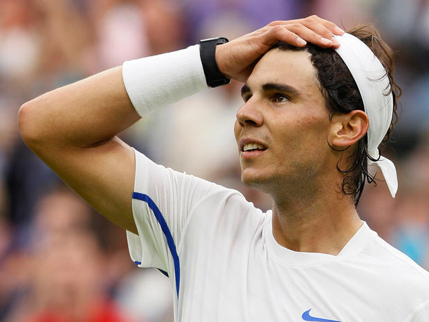 Rafael Nadal reacts after defeating Ryan Sweeting 