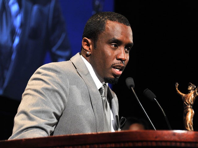 Recording artists Sean 'P. Diddy' Combs, left, congratulates  Janelle Monae, winner fo the second annual Essence 'Black Women in Music award, at the Playhouse Hollywood on Feb. 9, 2011, in Los Angeles.(Photo by Frederick M. Brown/Getty Images)  