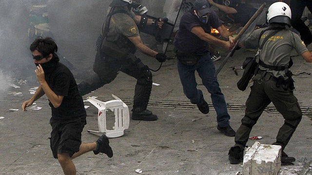 Protesters clash with riot police in Syntagma square in central Athens, June 29, 2011.  