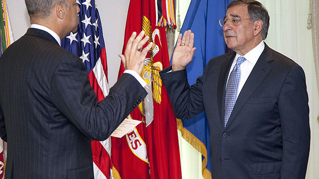 Leon Panetta, right, is sworn is as Defense Secretary by Pentagon General Counsel Jeh Johnson, July 1, 2011, at the Pentagon.  