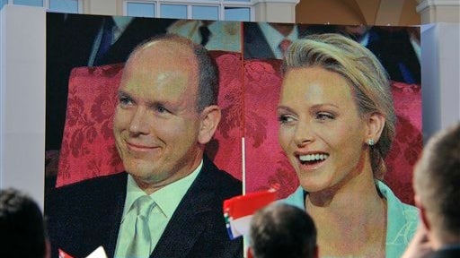 Charlene Wittstock and Prince Albert II of Monaco seen on giant screen outside Monaco palace Friday during their civil wedding marriage ceremony 