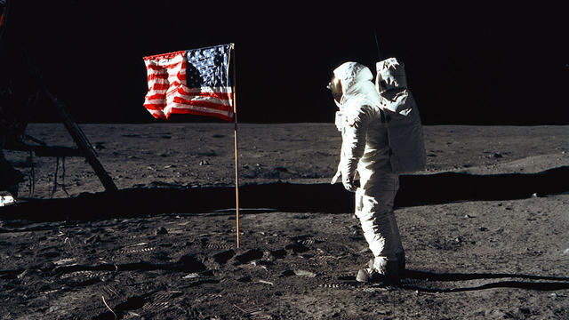 Buzz Aldrin moon landing with flag 