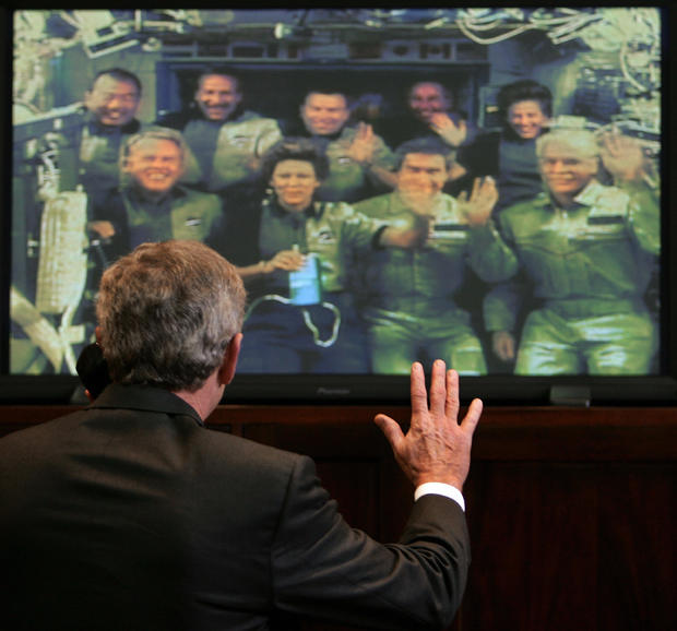 US President George W. Bush waves to the 