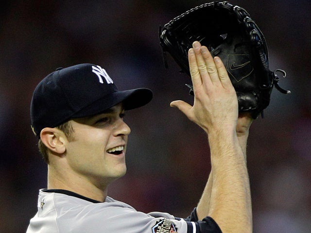 David Robertson applauds a catch by Jose Bautista  