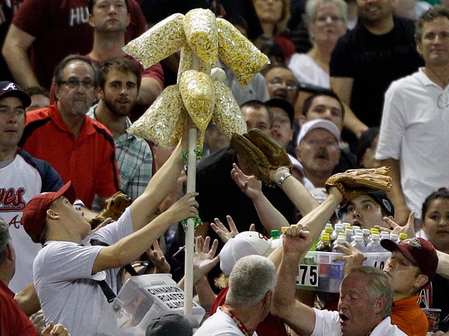popcorn vendor stops a foul ball  