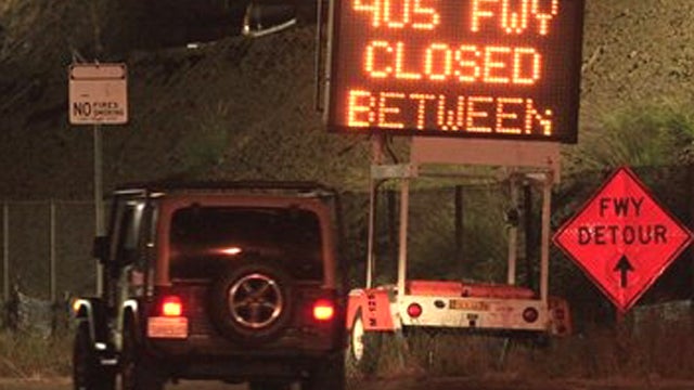 In this photo taken Wednesday, July 13, 2011 a sign warns drivers of the closure of the Interstate 405 freeway in Los Angeles. Beginning Friday evening, authorities will begin shutting down a 10-mile segment of the 405 freeway for 53 hours so crews can de 