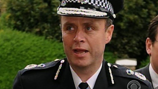 Top cop taken down in phone hacking scandal 