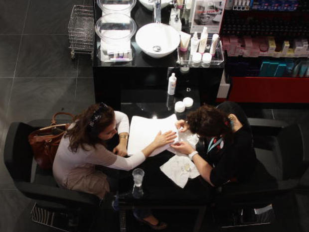 A customer receives a manicure 