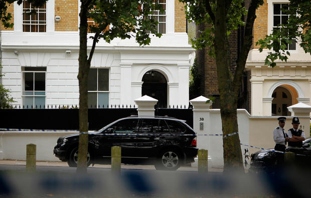 Police officers are seen outside the home of British singer Amy Winehouse in north London,  July, 23, 2011 