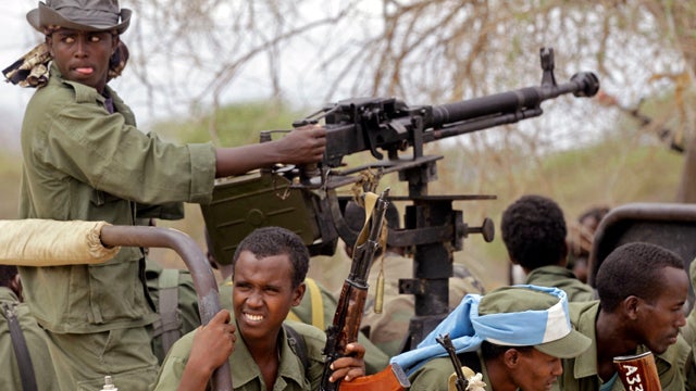 Somalian transitional government force soldiers provide security in the town of Dhobley July 27, 2011. A plane carrying 10 tons of urgently needed nutritional supplements to treat malnourished children landed in famine-hit Somalia, a U.N. official said. 