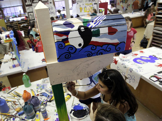 Victoria Santorelli, 17, of Bellmore, N.Y., paints a mailbox that will be displayed at the National September 11 Memorial at Ground Zero in New York City during an art class at Project Common Bond on the Foxcroft School campus in Middleburg, Va., July 27, 2011. Project Common Bond brings together offspring of 9/11 victims with other teens who have lost family members to acts of terror around the world. 