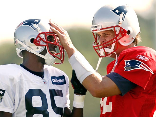 Tom Brady fools around with Chad Ochocinco 
