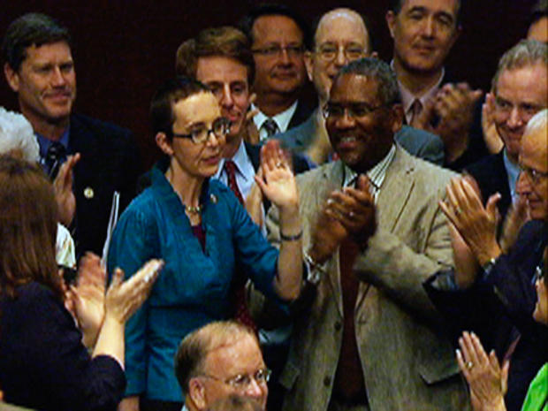 In this image from House Television, Rep. Gabrielle Giffords, D-Ariz., appears on the floor of the House of Representatives Monday, Aug. 1, 2011, in Washington. Giffords was on the floor for the first time since her shooting earlier this year, attending a vote on the debt standoff compromise 